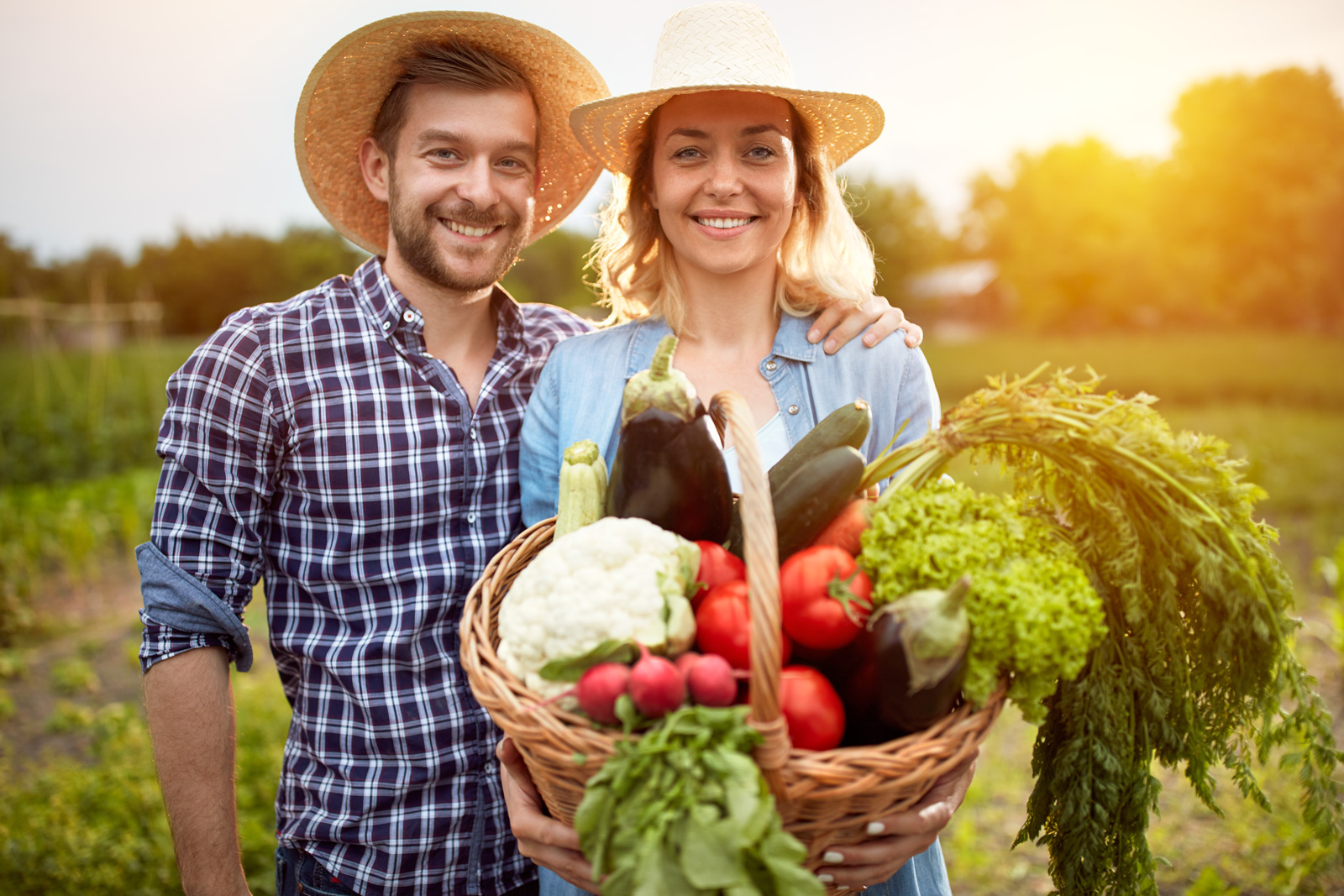 farmer-couple-with-basket-of-vegetables